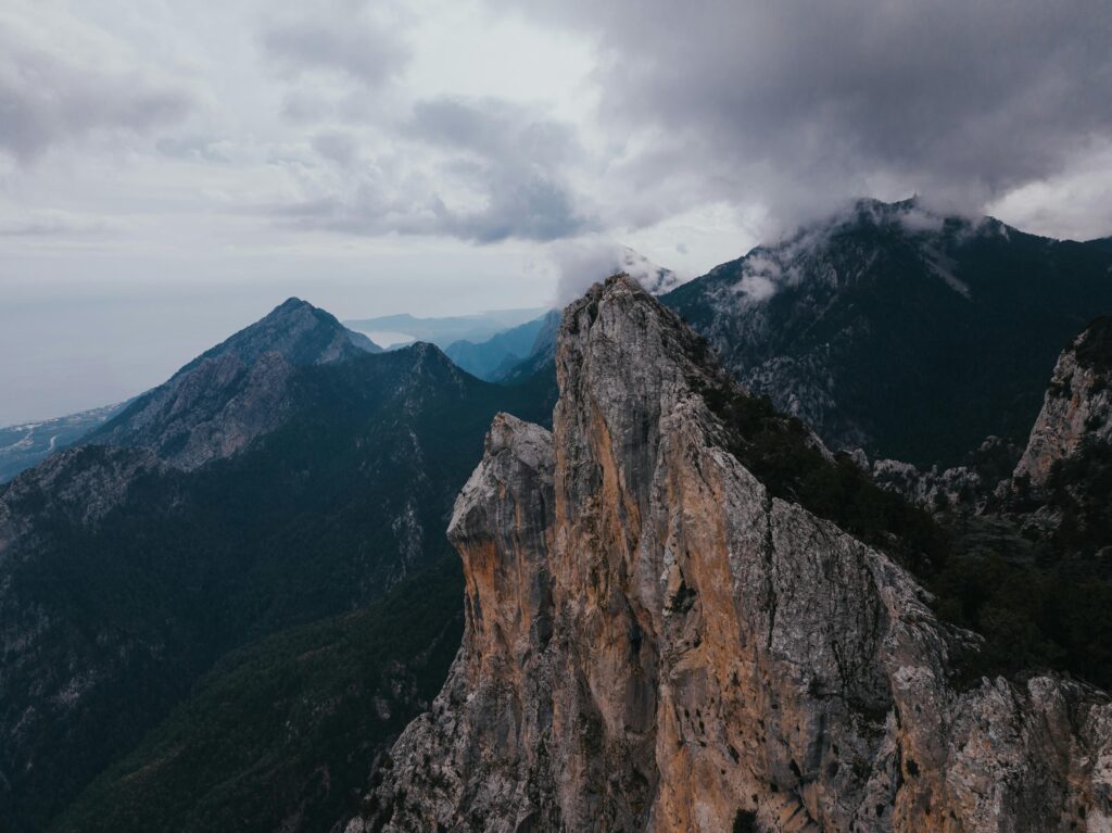 Majestic mountain peak with dramatic clouds in Antalya, Turkey, showcasing stunning natural beauty.
