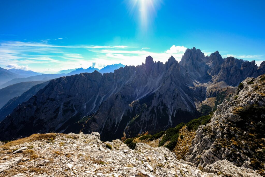 Breathtaking view of the Dolomites mountain peaks under a clear blue sky, perfect for adventure and nature enthusiasts.