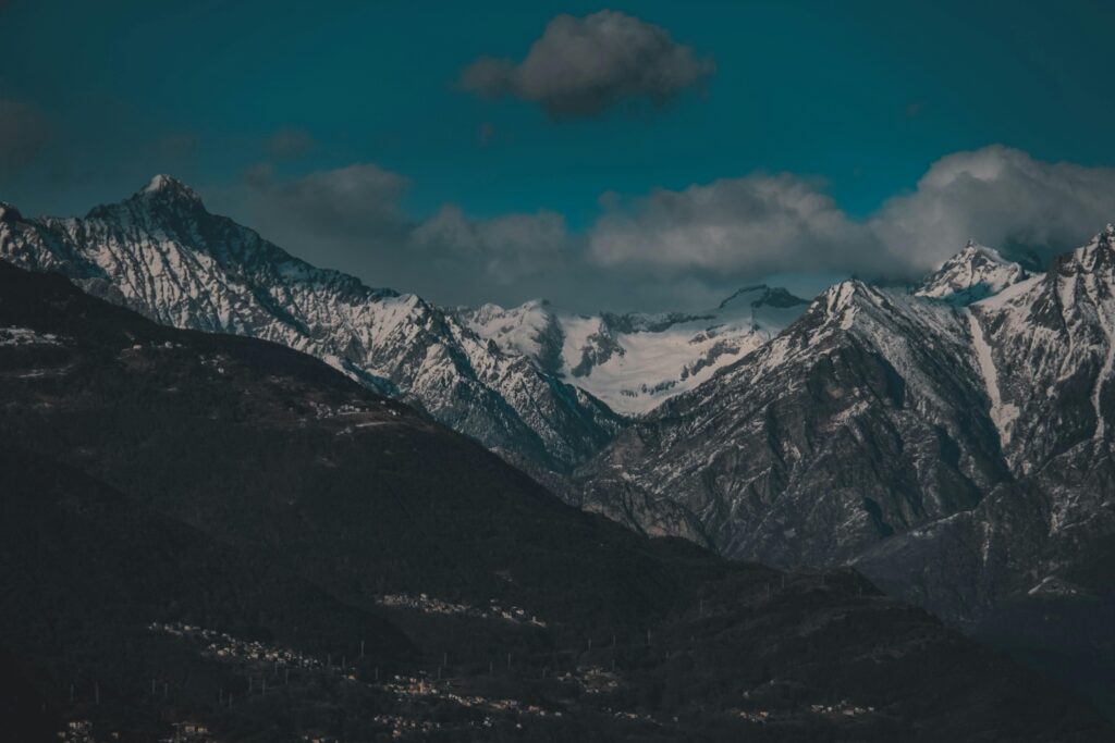 Breathtaking view of snowcapped mountains under a clear winter sky.